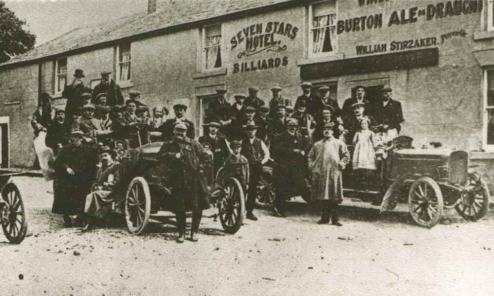 old photograph of people stood outside the Seven Stars Hotel in Stalmine
